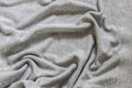 Wave-like folds on the fabric. Crumpled textiles, background. Royalty Free Stock Photo