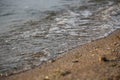 Wave rolling on the sandy shore of the Black Sea, Ukraine Royalty Free Stock Photo