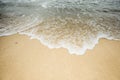 Wave on the sand beach Sepia tone
