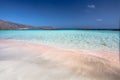 The wave of the sea on the pink sand and beautiful beach with the sand castle.Coast of Crete island in Greece Royalty Free Stock Photo