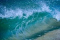 A wave smashing on the sand shore