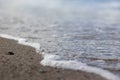 Wave splash sea beach macro, close up, Close up of sea foam and wet sand Royalty Free Stock Photo