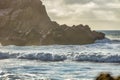 Wave splashes close-up. Crystal clear sea water hitting rock formations in the ocean in San Francisco Bay, blue water, pastel Royalty Free Stock Photo