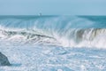 Wave splashes close-up. Crystal clear sea water hitting rock formations in the ocean in San Francisco Bay, blue water, pastel Royalty Free Stock Photo