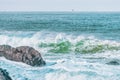 Wave splashes close-up. Crystal clear sea water hitting rock formations in the ocean in San Francisco Bay, blue water, pastel Royalty Free Stock Photo