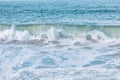 Wave splashes close-up. Crystal clear sea water hitting rock formations in the ocean in San Francisco Bay, blue water, pastel Royalty Free Stock Photo