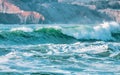 Wave splashes close-up. Crystal clear sea water hitting rock formations in the ocean in San Francisco Bay, blue water, pastel Royalty Free Stock Photo