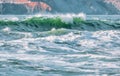 Wave splashes close-up. Crystal clear sea water hitting rock formations in the ocean in San Francisco Bay, blue water, pastel Royalty Free Stock Photo