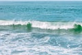 Wave splashes close-up. Crystal clear sea water hitting rock formations in the ocean in San Francisco Bay, blue water, pastel Royalty Free Stock Photo