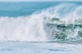 Wave splashes close-up. Crystal clear sea water hitting rock formations in the ocean in San Francisco Bay, blue water, pastel Royalty Free Stock Photo