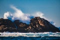 Wave splashing against a rock in the sea Royalty Free Stock Photo