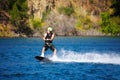 Wave, sports and wakeboarding with man in lake for action, summer break and travel vacation. Water splash, adrenaline Royalty Free Stock Photo