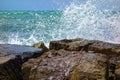 Wave spray againts rocks at sea ocean Royalty Free Stock Photo
