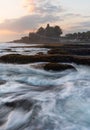 Wave and Tanah Lot Temple in Bali, in sunset