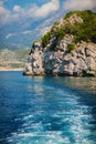 Wave trace tails of speed boat on blue water surface in the sea