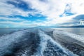 Wave trail from the boat in the ocean with Negros in the back, Philippines