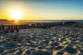 Wavebreakers at low tide and sunset Royalty Free Stock Photo