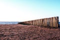 Wavebreakers at low tide and sunset Royalty Free Stock Photo