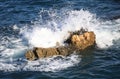 Waves against a cliff Royalty Free Stock Photo