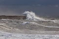 Waves against harbor wall