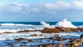 Waves of the Atlantic Ocean breaking on the rocky shores of Cape of Good Hope Royalty Free Stock Photo