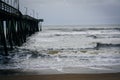 Waves in the Atlantic Ocean and the Fishing Pier in Virginia Beach, Virginia. Royalty Free Stock Photo