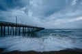 Waves in the Atlantic Ocean and the fishing pier in Virginia Beach, Virginia. Royalty Free Stock Photo