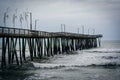 Waves in the Atlantic Ocean and the Fishing Pier in Virginia Beach, Virginia. Royalty Free Stock Photo