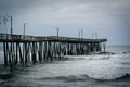 Waves in the Atlantic Ocean and the Fishing Pier in Virginia Beach, Virginia. Royalty Free Stock Photo