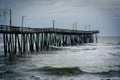 Waves in the Atlantic Ocean and the Fishing Pier in Virginia Beach, Virginia. Royalty Free Stock Photo