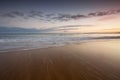 Sea sweeping over golden sand Royalty Free Stock Photo