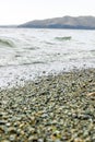 Waves on the beach, sand and water in the beach, stone on the beach Royalty Free Stock Photo