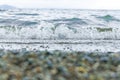 Waves on the beach, sand and water in the beach, stone on the beach Royalty Free Stock Photo