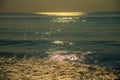 Sunrise reflection waves at beach sea water motion blur