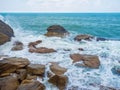 The waves beat on the rocks of the coast of Koh Pangan