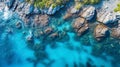 Waves in a blue ocean lagoon on the stones beach. An aerial view of the shoreline. Calm rocky beach on the seashore, beautiful Royalty Free Stock Photo