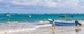 Waves boats caribbean coast and beach panorama view Tulum Mexico