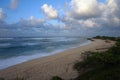 Waves break and crash towards the Hanakailio Beach with dramatic Royalty Free Stock Photo