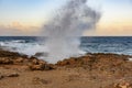 Waves break on the rocks