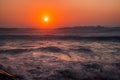 Waves breaking with a colorful sunset reflection on Vieira beach, Marinha Grande PORTUGAL