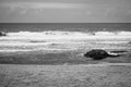 Waves breaking gently against the shore at Moledo Portugal