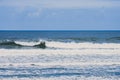 Waves breaking gently against the shore at Moledo Portugal