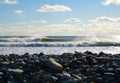 Waves breaking left on a sunny day