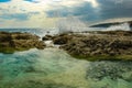 Waves breaking over coastal rocks