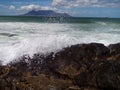 Waves breaking over ocean rocks in sea Royalty Free Stock Photo