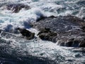 Waves breaking over rocks Royalty Free Stock Photo