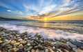 Waves breaking on pebble beach Royalty Free Stock Photo