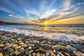 Waves breaking on pebble beach Royalty Free Stock Photo