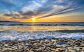 Waves breaking on pebble beach Royalty Free Stock Photo