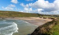 Waves breaking Porthcothan Bay and beach Cornwall England UK Cornish north coast Royalty Free Stock Photo